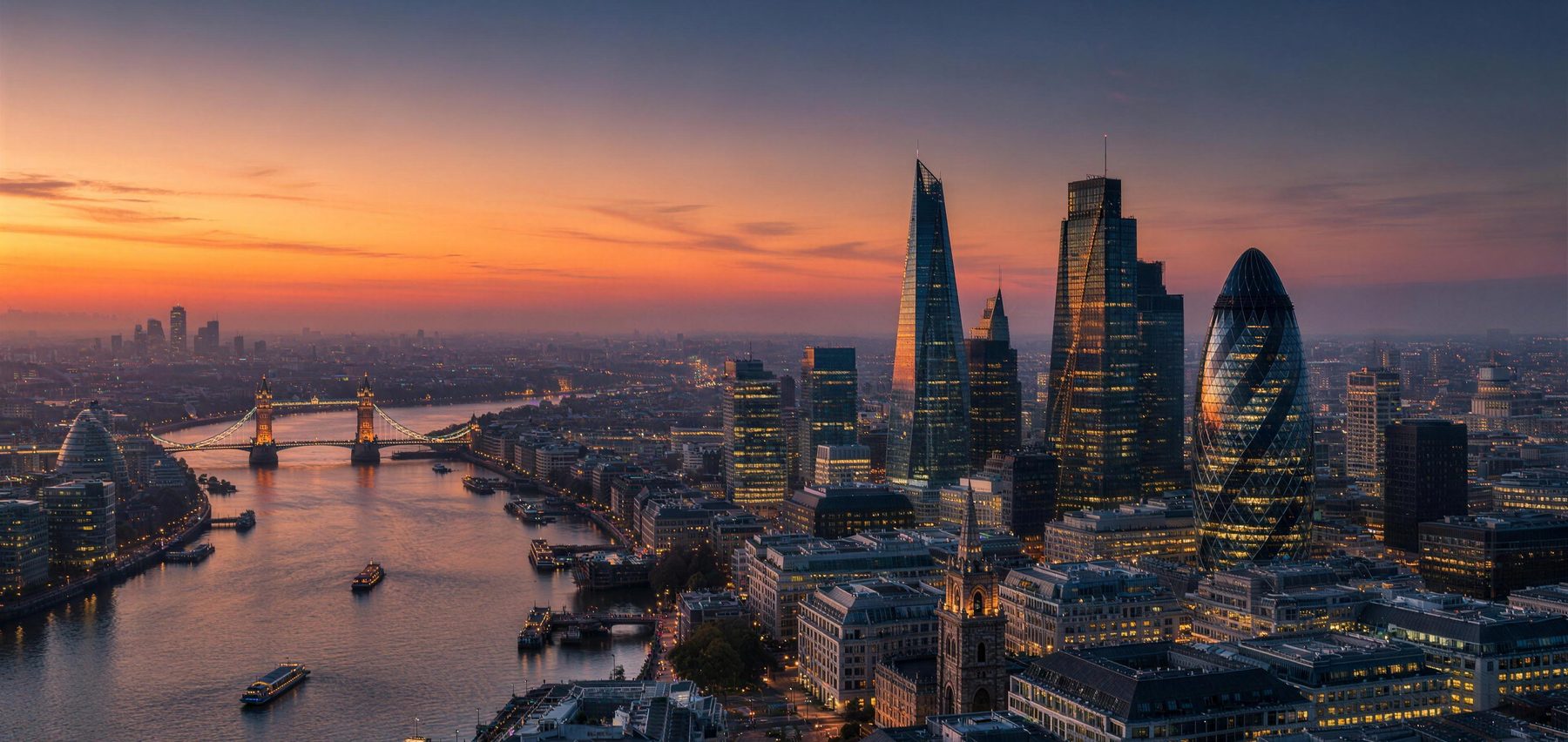 The City of London at dusk, the Thames leading past Tower Bridge toward the financial district